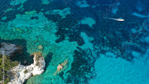 Aerial drone photo of paradise tropical exotic white rocky deep turquoise seascape forming a blue lagoon visited by yachts and sail boats in Caribbean popular destination