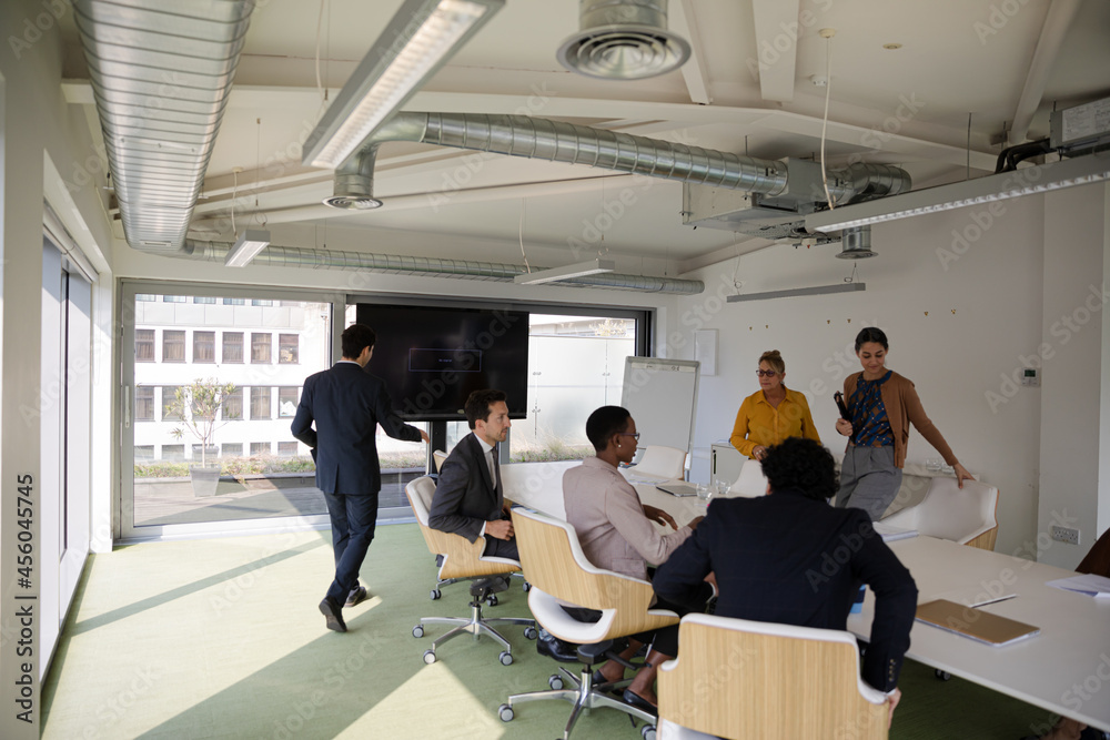 Business people gathering in conference room meeting Business people gathering in conference room meeting