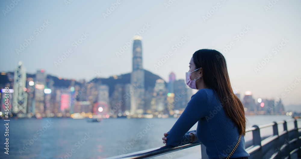 Woman wear face mask and use of smart phone at night Woman wear face mask and use of smart phone at night