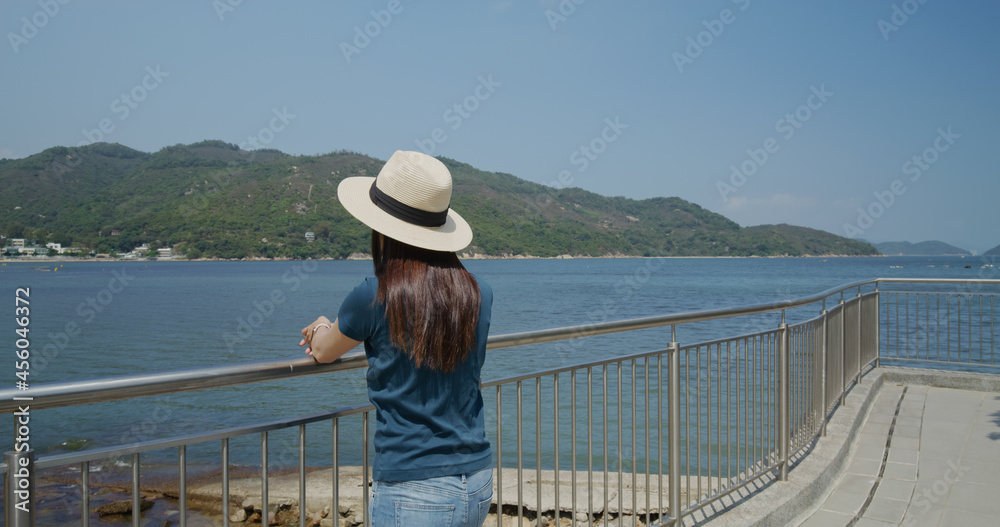 Woman enjoy the sea view in countryside