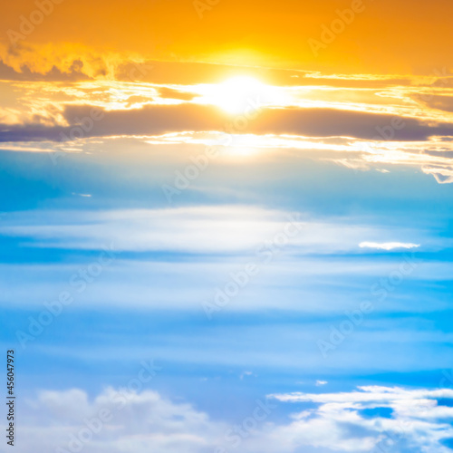 Sunset sky with sun rays and sunset clouds