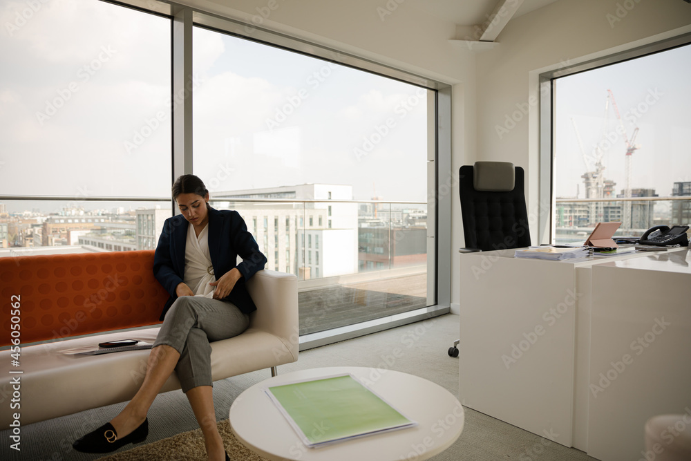 Portrait of businesswoman using smartphone in office Portrait of businesswoman using smartphone in office
