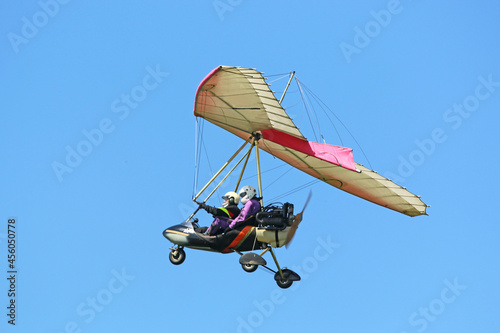 Valokuva Ultralight airplane flying in a blue sky