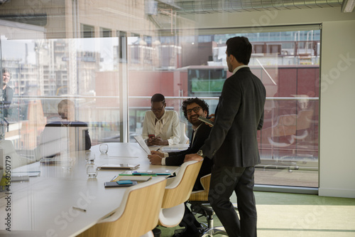 Businessman leading conference room meeting