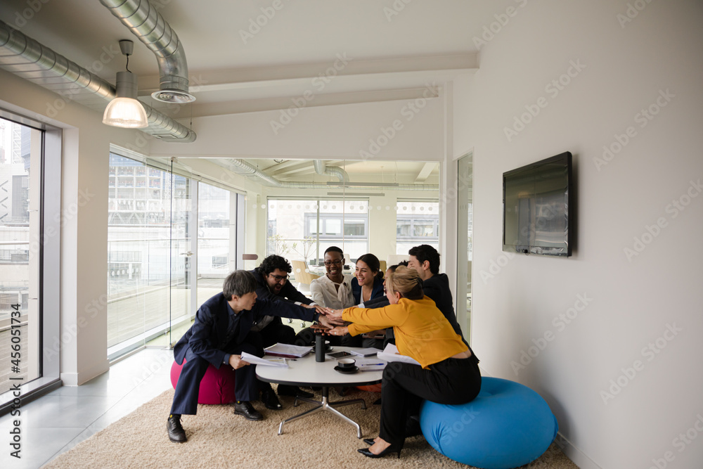 Business people discussing paperwork in relax zone Business people discussing paperwork in relax zone