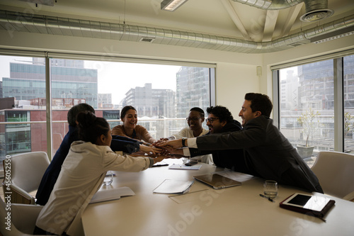 Happy business people celebrating success in office