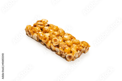 Bar with nuts isolated on a white background. Hazelnut bar.