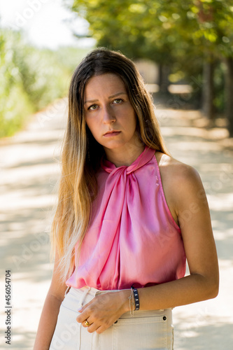 Portrait of a young caucasian model wearing a pink top