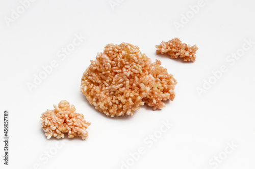 Indonesian traditional thick rice cracker called Rengginang or ranginang isolated on white background. photo