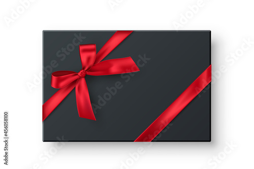 Black rectangle gift box, present realistic vector illustration. Birthday, christmas holiday, wedding anniversary celebration accessory top view. 3D container with red ribbon bow isolated on white.