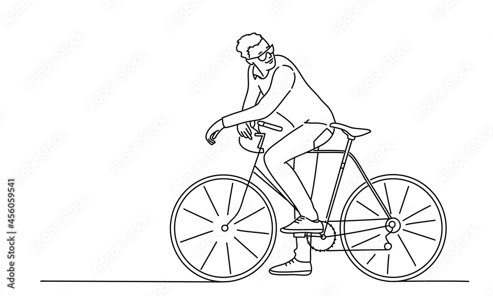 Fototapeta premium Young man with bicycle looks back.