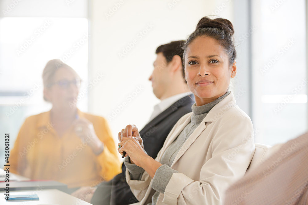 Portrait of smiling businesswoman in conference room meeting Portrait of smiling businesswoman in conference room meeting
