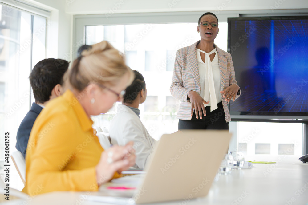 Businesswoman leading conference room meeting Businesswoman leading conference room meeting