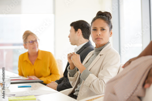 Portrait of smiling businesswoman in conference room meeting