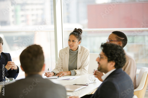 Businesswoman leading conference room meeting photo