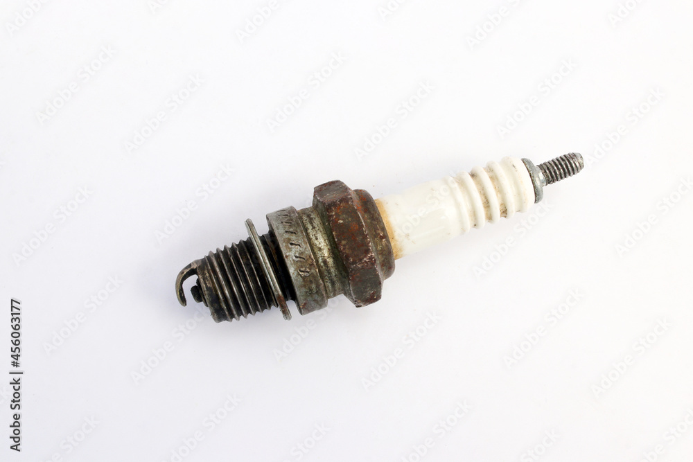 Old used spark plug isolated on white background. Old used spark plug isolated on white background.