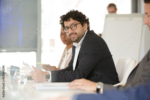Portrait of businessman in conference room meeting