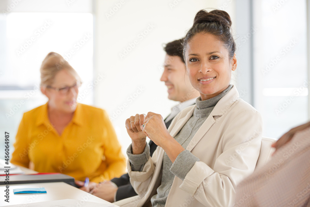 Fototapeta premium Portrait of smiling businesswoman in conference room meeting
