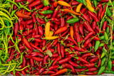 Mix of chili peppers, bell peppers, capi color assortment on vegetable market.