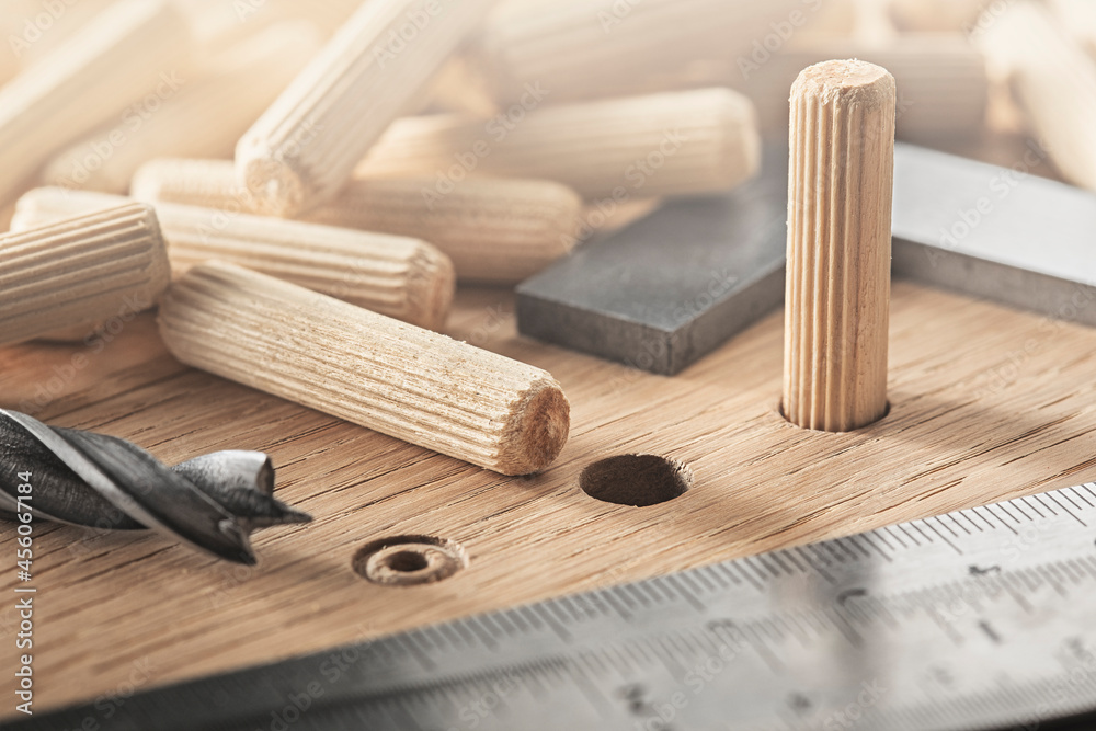 drill bit make hole for dowel in wooden oak board drill bit make hole for dowel in wooden oak board