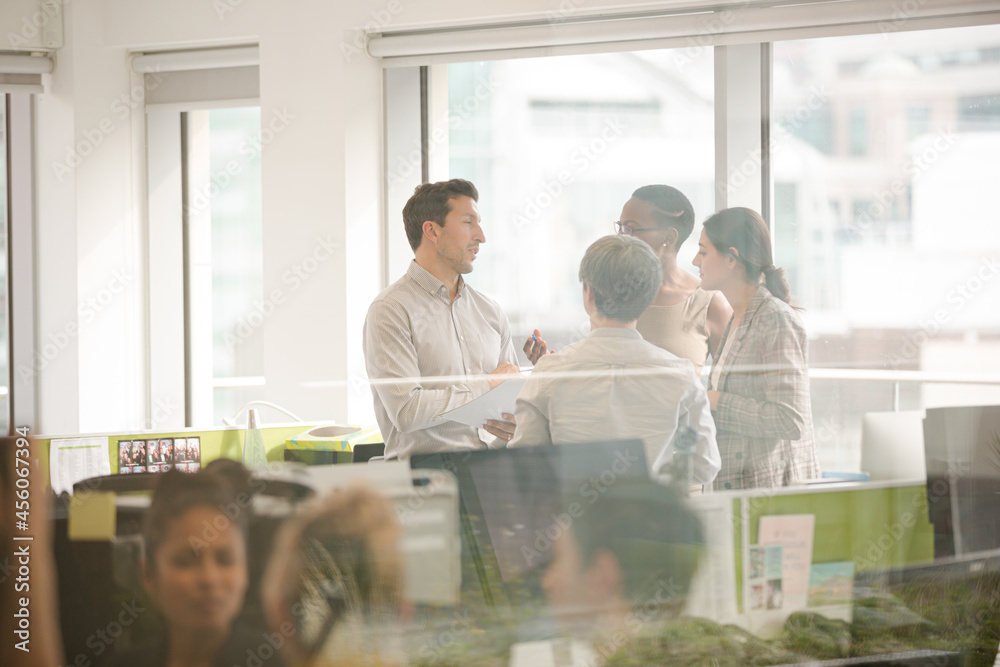 Fototapeta premium Business people talking in open plan office