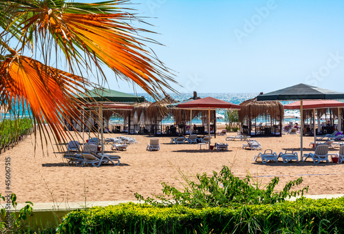 Fototapeta Naklejka Na Ścianę i Meble -  Sunbeds and tents on a beach in south Turkey