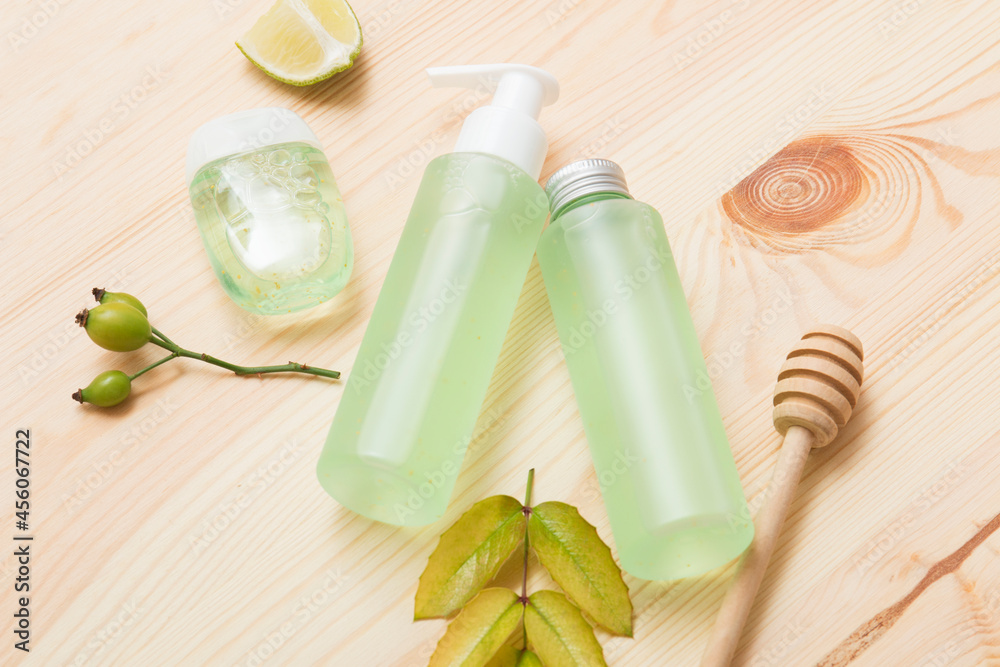 Natural cosmetic products on a light wooden. Mockup of cosmetic bottles. Natural cosmetic products on a light wooden. Mockup of cosmetic bottles.