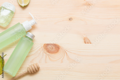 Natural cosmetic products on a light wooden. Mockup of cosmetic bottles.