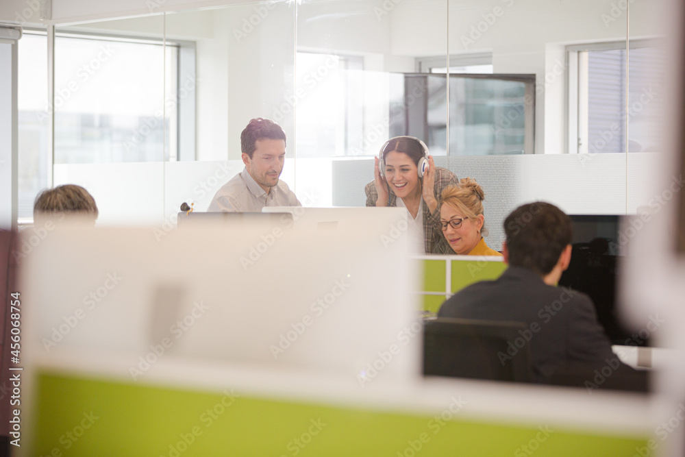 Business people brainstorming in open plan office Business people brainstorming in open plan office