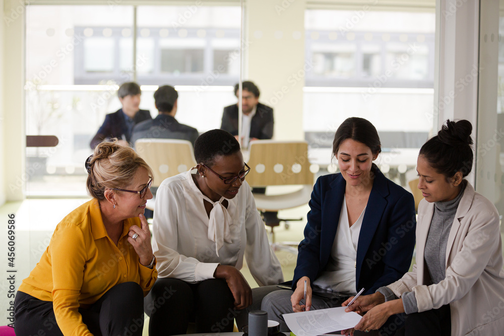 Enthusiastic business people working together in relax zone