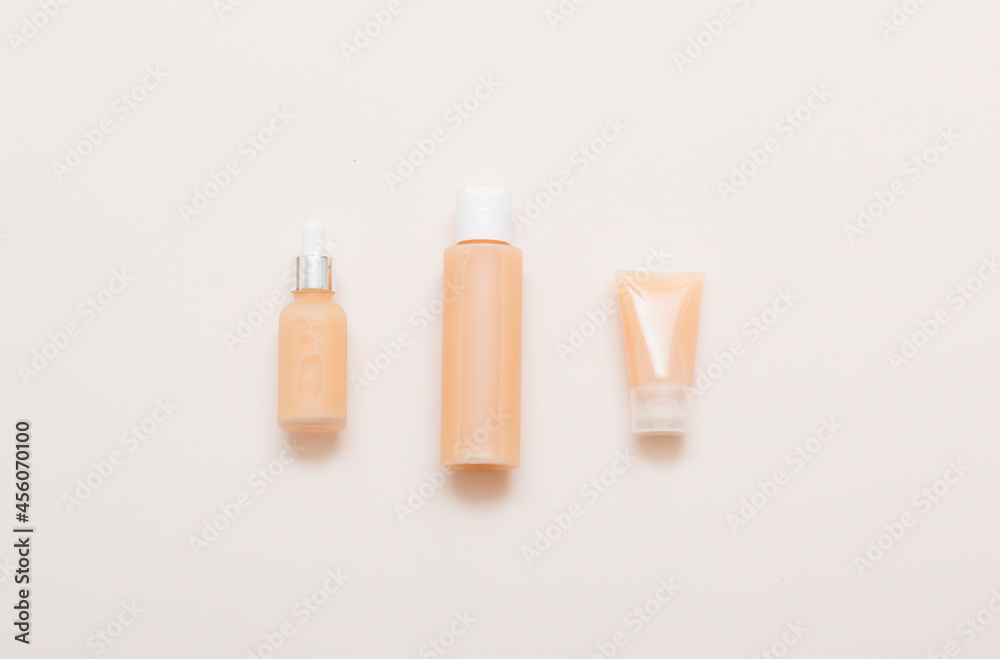 Natural cosmetic products on a light background. Mockup of cosmetic jars, bottles, tubes.