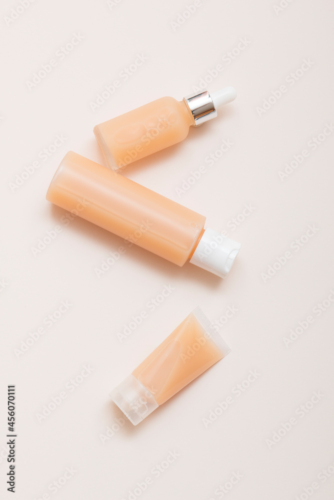 Natural cosmetic products on a light background. Mockup of cosmetic jars, bottles, tubes.
