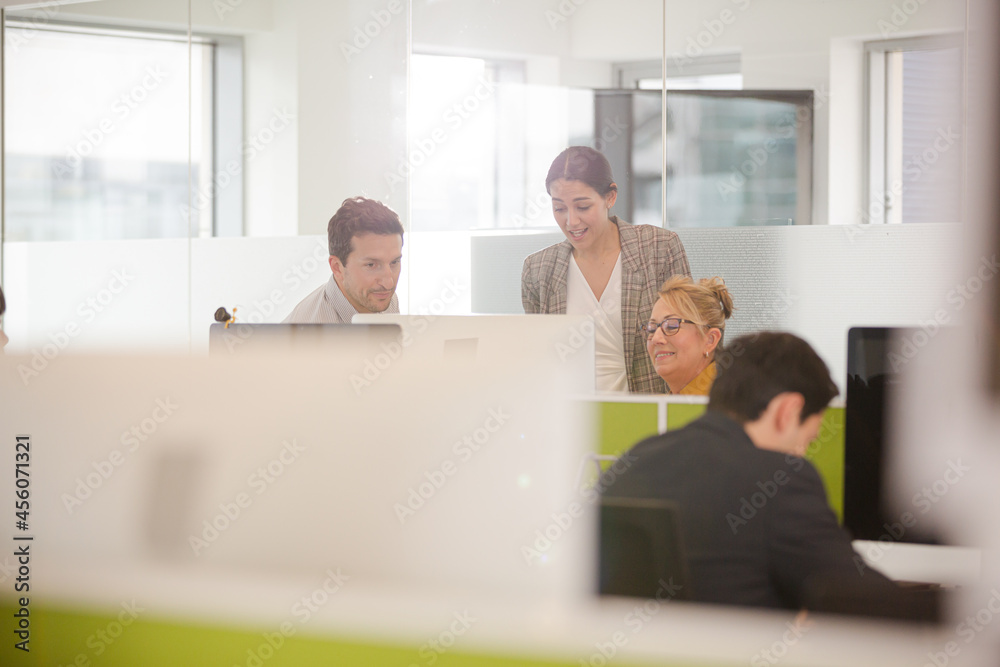 Business people brainstorming in open plan office Business people brainstorming in open plan office