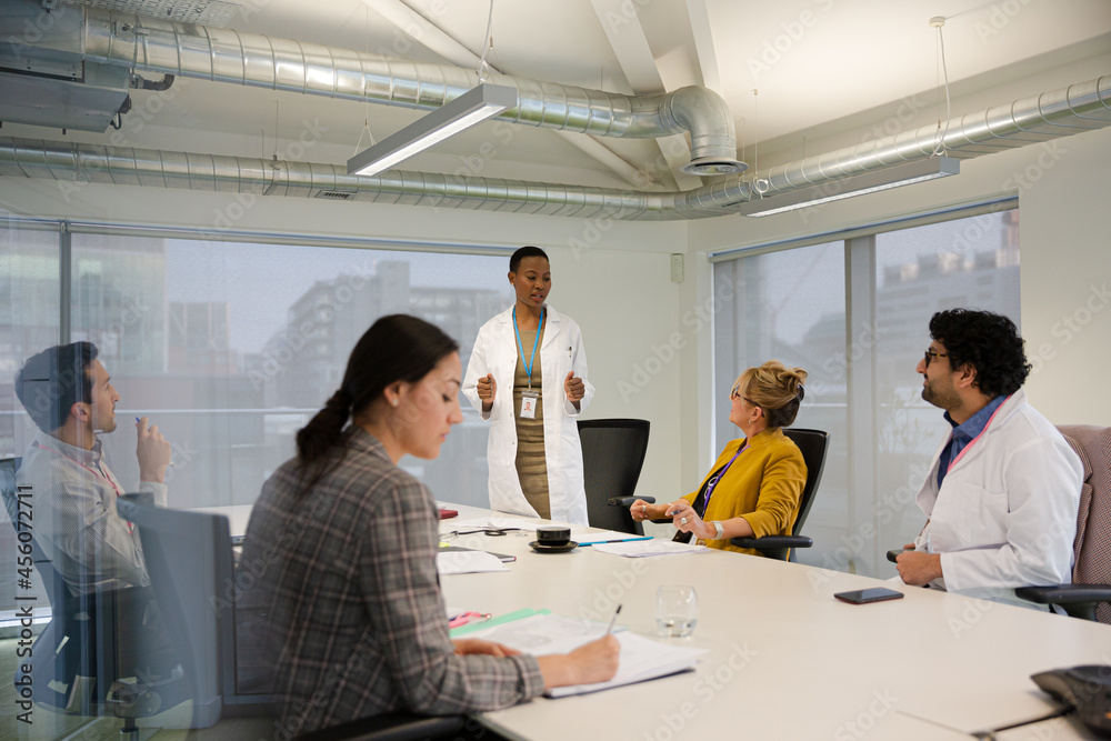 Businesswoman leading conference room meeting Businesswoman leading conference room meeting
