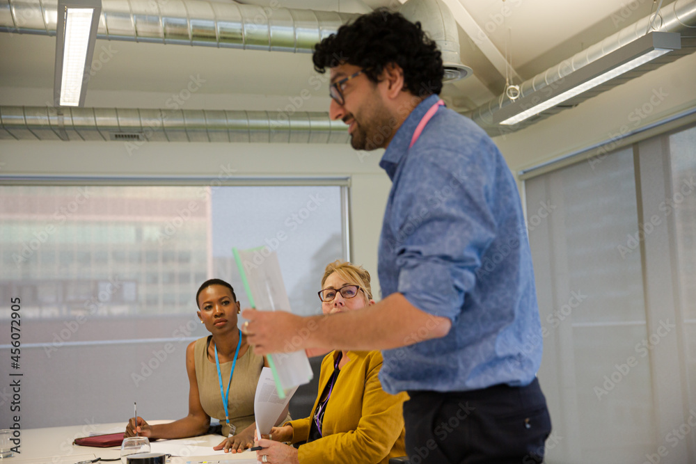 Businessman leading conference room meeting Businessman leading conference room meeting