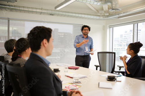 Businessman leading conference room meeting