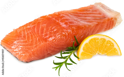 Red fish. Raw salmon fillet with rosemary and lemon isolate on white background. Clipping path and full depth of field