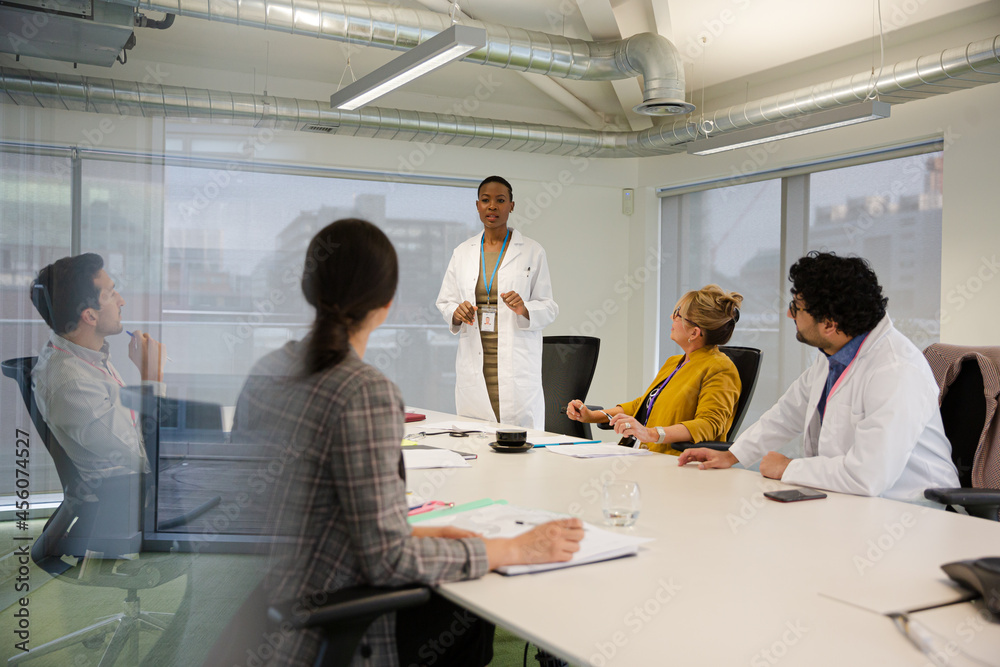 Businesswoman leading conference room meeting