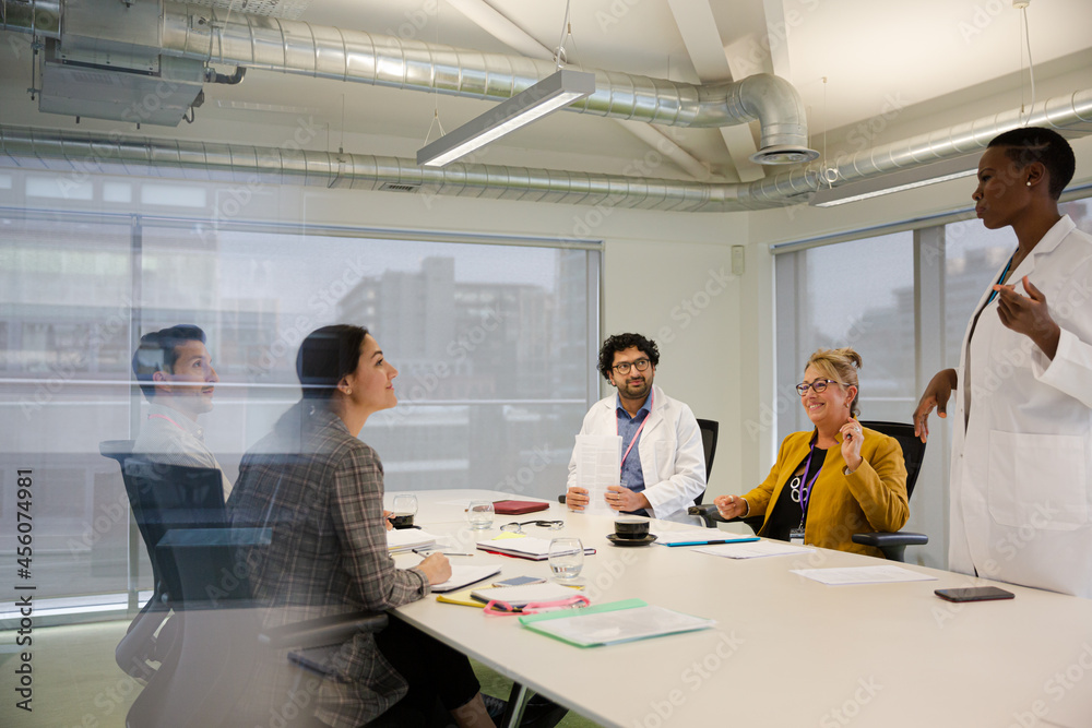 Businesswoman leading conference room meeting