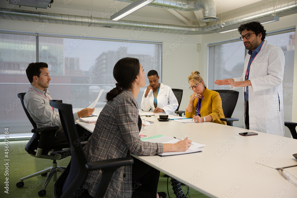 Businessman leading conference room meeting Businessman leading conference room meeting