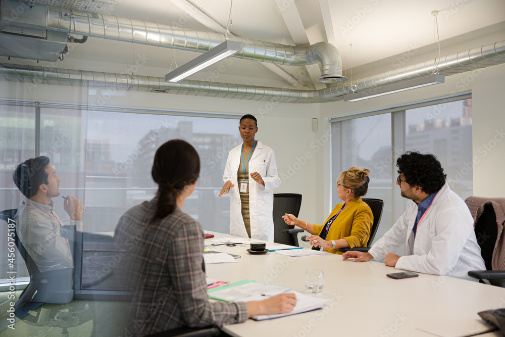 Businesswoman leading conference room meeting Businesswoman leading conference room meeting
