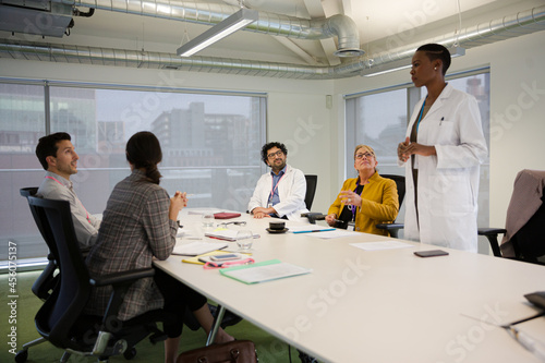 Businesswoman leading conference room meeting