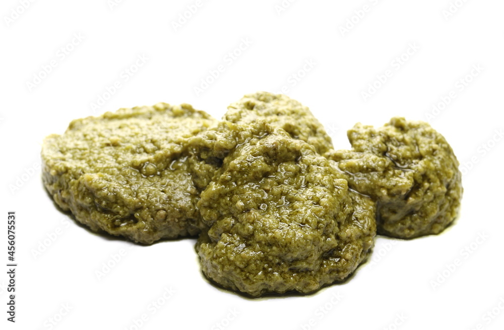 Genovese basil paste isolated on white background Genovese basil paste isolated on white background