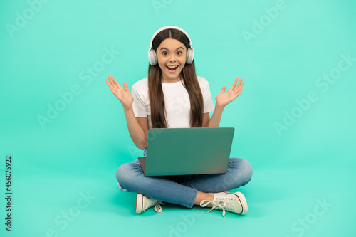 surprised girl buy online. back to school. teen influencer blogging. webinar in wireless headset © Olena