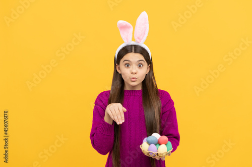 happy easter. childhood happiness. child in rabbit costume hold painted eggs. time for egg hunt