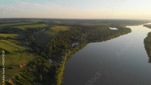Aerial view of big siberian Ob river, river bank in beauty summer evening, 4K drone footage.