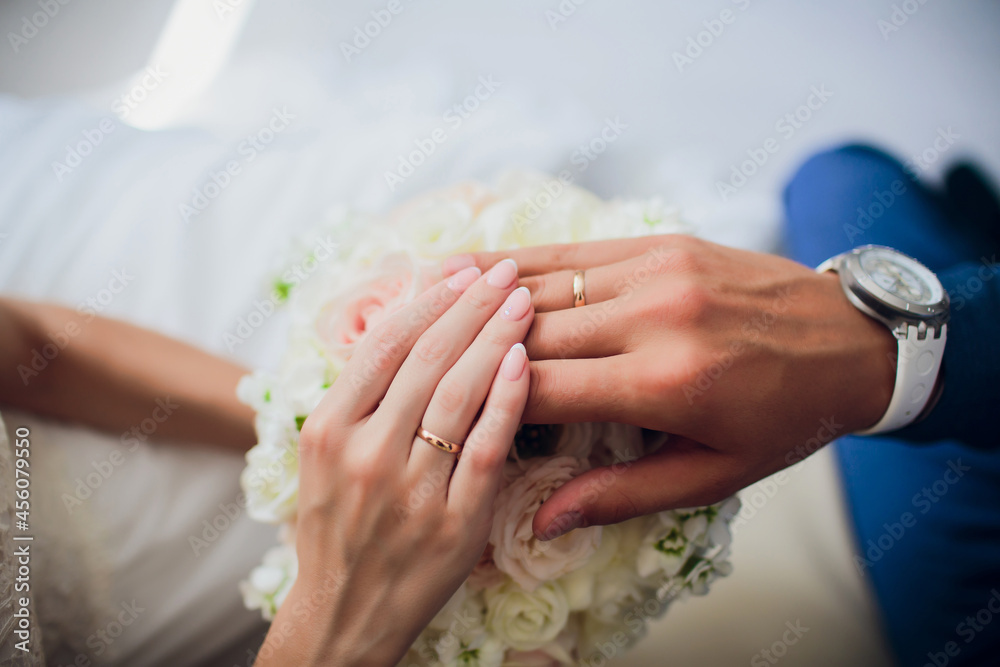 Groom and brides hands with rings, closeup view. - obrazy, fototapety, plakaty 
