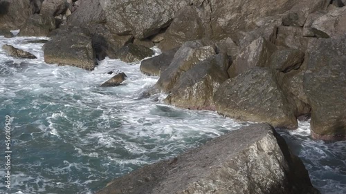 Water splashing. Pirate Bay Novy Svet Places. Mount Eagle is an ancient coral reef colonies. Sea water beats against rocks. Crimea. Novy Svet place.