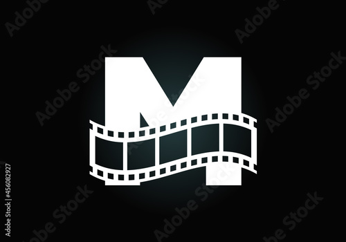 Initial M monogram alphabet incorporated with film reel. Video and movie logo concept. Font emblem. Logo for the entertainment business and company identity