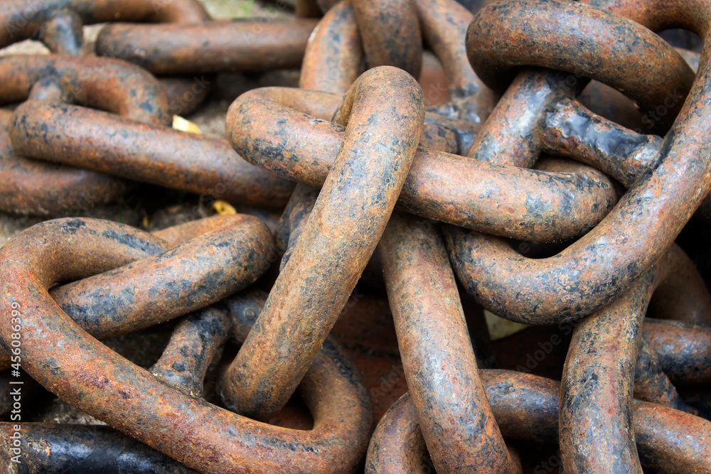Heavy metallic randomly arranged messy chain with orange rust. Heavy metallic randomly arranged messy chain with orange rust.